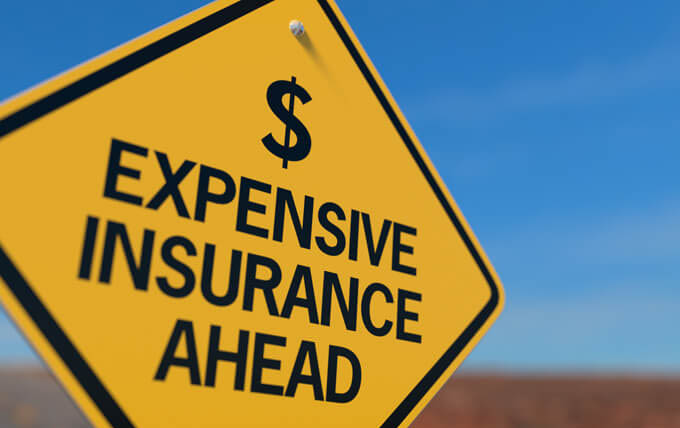 Photo of expensive car insurance sign