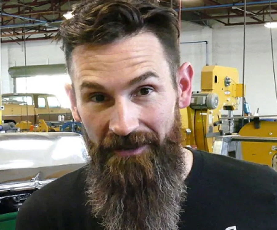 Image of Aaron Kaufman in garage